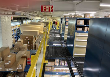 organized warehouse with cardboard boxes and storage shelves